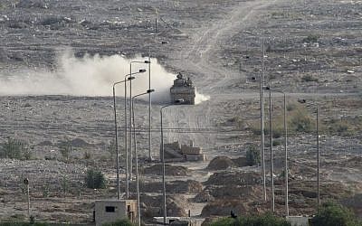 An Egyptian military personnel carrier patrols on the Egyptian side of the border between Egypt and Rafah in the southern Gaza Strip, Wednesday, July 1, 2015 (AP/Mohammed Ebaid)