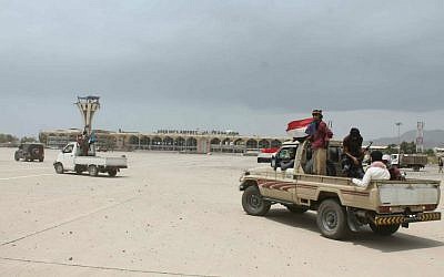 Fighters against Shiite rebels known as Houthis gather in front of the airport in the port city of Aden, Yemen, July 16, 2015. (AP/Abo Muhammed)