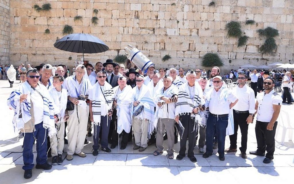 Holocaust survivors celebrate their bar mitzvah at the Western Wall, in Jerusalem, on Monday, July 13 2015. (Oren Hassidim)