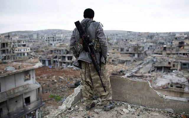 A Syrian Kurdish sniper looks at the rubble in the Syrian city of Ain al-Arab, also known as Kobani, Jan. 30, 2015. (AP, File) A Syrian Kurdish sniper looks at the rubble in the Syrian city of Ain al-Arab, also known as Kobani, Jan. 30, 2015. (AP, File)
