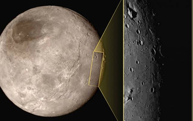 This photo taken Tuesday, July 14, 2015, at approximately 6:30 a.m. EDT, shows Pluto's largest moon Charon, left, with a captivating feature, a depression with a peak in the middle, shown in the upper left corner of the inset image at right. (NASA/JHUAPL/SwRI via AP) This photo taken Tuesday, July 14, 2015, at approximately 6:30 a.m. EDT, shows Pluto's largest moon Charon, left, with a captivating feature, a depression with a peak in the middle, shown in the upper left corner of the inset image at right. (NASA/JHUAPL/SwRI via AP)