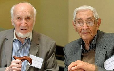 File: Rescuers Janusz Durko, 100 years old, right, and Wladyslaw Misiuna, 90 years old, attend an event gathering nearly 50 elderly Christian Poles who saved Jews during World War II, in Warsaw, Poland, Sunday, July 12, 2015. (AP Photo/Alik Keplicz)