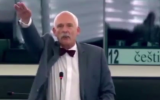 Polish European MP Janusz Korwin-Mikke makes the Hitler salute on Wednesday, July 8, 2015 (screen capture:YouTube)