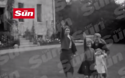 A still from a video published by Britain's The Sun newspaper which allegedly shows Queen Elizabeth II, as a child (second from left), performing the Nazi salute with her parents. (screen capture: YouTube)