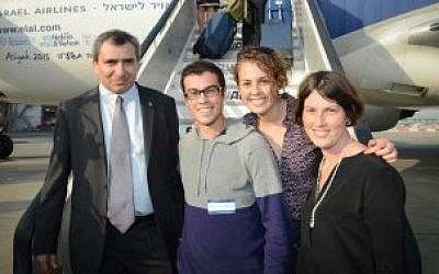Yaniv and Hilla Singerman are flanked by Israel’s minister of aliyah and immigration absorption, Zeev Elkin, left, and their sister, Rachel Gur, an adviser to Elkin, at Ben Gurion Airport near Tel Aviv, July 14, 2015. (Courtesy of Shahar Azran/Nefesh B’Nefesh/JTA) Yaniv and Hilla Singerman are flanked by Israel’s minister of aliyah and immigration absorption, Zeev Elkin, left, and their sister, Rachel Gur, an adviser to Elkin, at Ben Gurion Airport near Tel Aviv, July 14, 2015. (Courtesy of Shahar Azran/Nefesh B’Nefesh/JTA)
