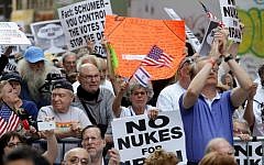 Supporters react to a speech by Republican presidential candidate former New York Gov. George Pataki at the 'Stop Iran' protest Wednesday, July 22, 2015, near Times Square in New York. (AP Photo/Frank Franklin II)