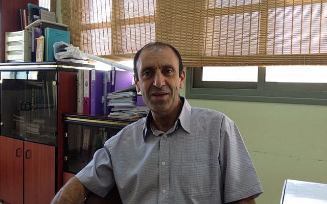Dr. Taisseer Maray, director of Golan for Development of the Arab Villages, at his office in Majdal Shams, July 8, 2015 (Elhanan Miller/Times of Israel)
