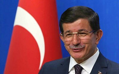 Turkish Prime Minister and leader of Justice and Development Party Ahmet Davutoglu speaks to the media after a meeting with Kemal Kilicdaroglu, the leader of the main opposition Republican People's Party, CHP, in Ankara, Turkey, Monday, July 13. 2015. (AP Photo/Burhan Ozbilici)