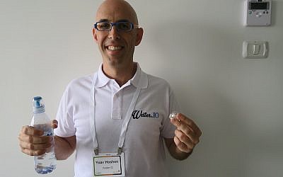 Yoav Hoshen of WaterIO holds one of his company's "connected" bottles. His company is looking to join The Kitchen incubator, June 25 2015 (Courtesy)