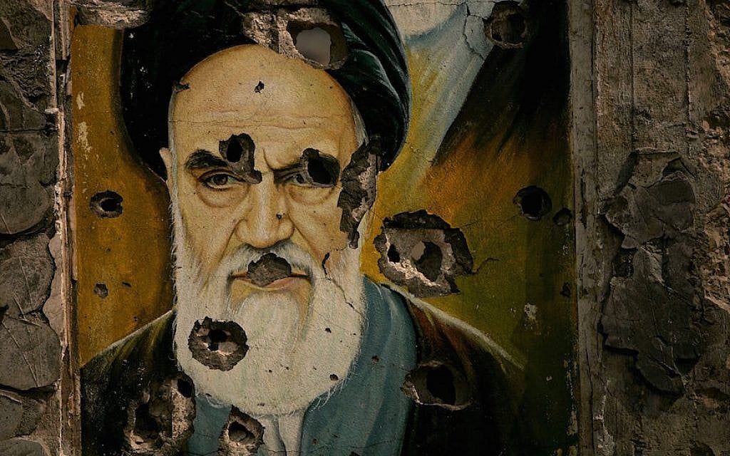 A bullet ridden picture of Ayatollah Ruhollah Khomeini, the late founder of Iran's Islamic Republic, is displayed in Bent Jbail, Lebanon. (Photo by Spencer Platt/Getty Images, via JTA) A bullet ridden picture of Ayatollah Ruhollah Khomeini, the late founder of Iran's Islamic Republic, is displayed in Bent Jbail, Lebanon. (Photo by Spencer Platt/Getty Images, via JTA)