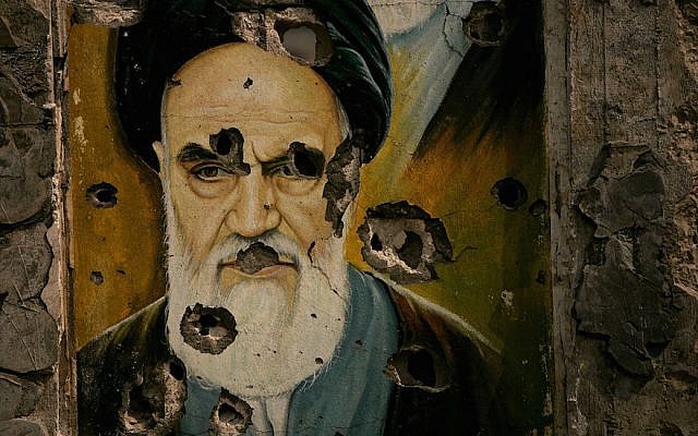 A bullet ridden picture of Ayatollah Ruhollah Khomeini, the late founder of Iran's Islamic Republic, is displayed in Bent Jbail, Lebanon.  (Photo by Spencer Platt/Getty Images, via JTA)