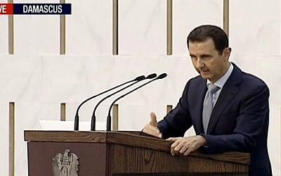 Syrian President Bashar Assad delivering a speech in Damascus, Syria on Sunday, July 26, 2015. (Press TV via AP video)