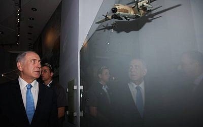 Prime Minister Benjamin Netanyahu tours the new Entebbe exhibition at the Rabin Center on July 9, 2015. His brother Yoni was killed in the 1976 hostage rescue mission. (via Facebook)