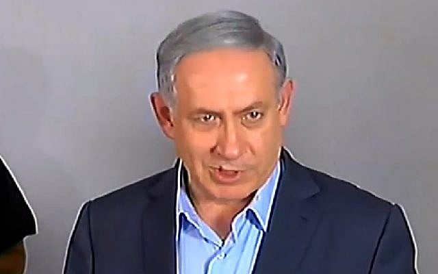 Prime Minister Benjamin Netanyahu speaks to reporters on July 10, 2015 outside the family home of Avraham Mensigu, an Israeli captive held in Gaza. (Screen capture/Channel 2) Prime Minister Benjamin Netanyahu speaks to reporters on July 10, 2015 outside the family home of Avraham Mensigu, an Israeli captive held in Gaza. (Screen capture/Channel 2)