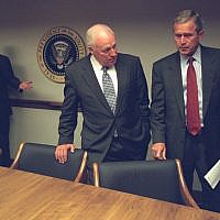 Then-president George W. Bush talks to his vice president Dick Cheney in the President's Emergency Operations Center in the White House on September 11, 2001. (photo credit: US National Archives)