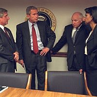 Then-president George W. Bush confers with members of his administration, including his vice president Dick Cheney and national security adviser Condoleezza Rice in the President's Emergency Operations Center in the White House on September 11, 2001. (photo credit: US National Archives)