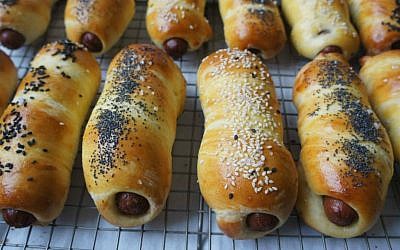 Challah hot dogs can be topped a number of ways. (Shannon Sarna/via JTA)