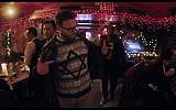Seth Rogen has a moment with New York Hassids in a Chinese restaurant on Christmas eve in his November release, 'The Night Before.' (YouTube screenshot)