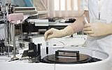 A clinician works on a new medical formulation at a lab (Pexels)