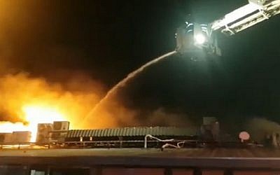 A fire burns at the Tel Aviv port restaurant Mul Hayam (screen capture: Ynet)