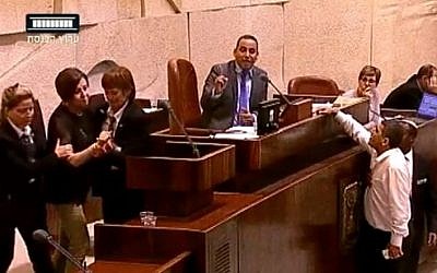Meretz chairwoman Zehava Gal-on is removed from the Knesset plenum for insulting an MK on July 13, 2015. (screen grab: YouTube)