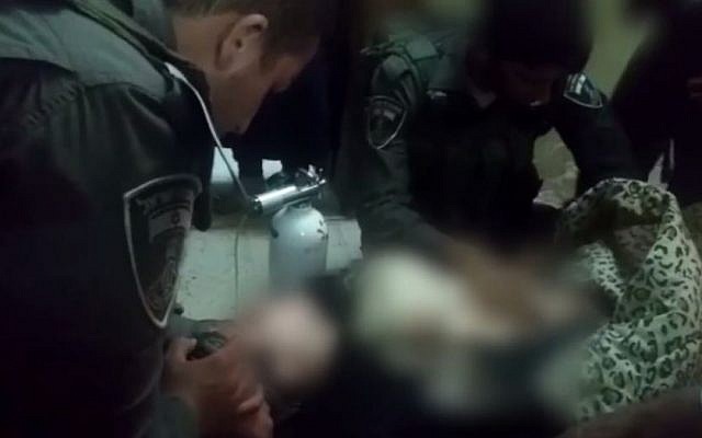 Israeli Border Police assist a young Palestinian girl suffering from respiratory distress in the West Bank town of Hebron on July 30, 2015. (screen grab: Facebook) Israeli Border Police assist a young Palestinian girl suffering from respiratory distress in the West Bank town of Hebron on July 30, 2015. (screen grab: Facebook)