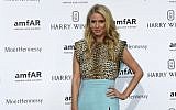 US socialite Nicky Hilton arrives for the amfAR dinner on the sidelines of the Paris fashion week in Paris on July 5, 2015. (AFP/LOIC VENANCE)