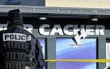 Police stand guard outside the kosher supermarket in Paris in July 2015, where four Jews were murdered six months earlier in a hostage siege by an Islamist gunman. (Serge Attal/Flash90)