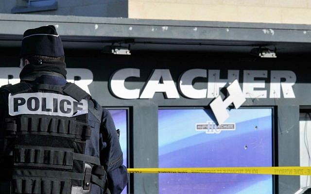 Police stand guard outside the kosher supermarket in Paris in July 2015, where four Jews were murdered six months earlier in a hostage siege by an Islamist gunman. (Serge Attal/Flash90) Police stand guard outside the kosher supermarket in Paris in July 2015, where four Jews were murdered six months earlier in a hostage siege by an Islamist gunman. (Serge Attal/Flash90)