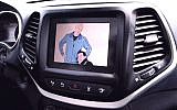 As part of their hack, Charlie Miller and Chris Valasek broadcast their cartoon images on the entertainment center display of a Jeep Cherokee driven by Wired's Andy Greeberg (Youtube screenshot)