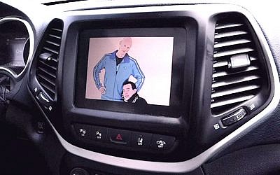 As part of their hack, Charlie Miller and Chris Valasek broadcast their cartoon images on the entertainment center display of a Jeep Cherokee driven by Wired's Andy Greeberg (Youtube screenshot)