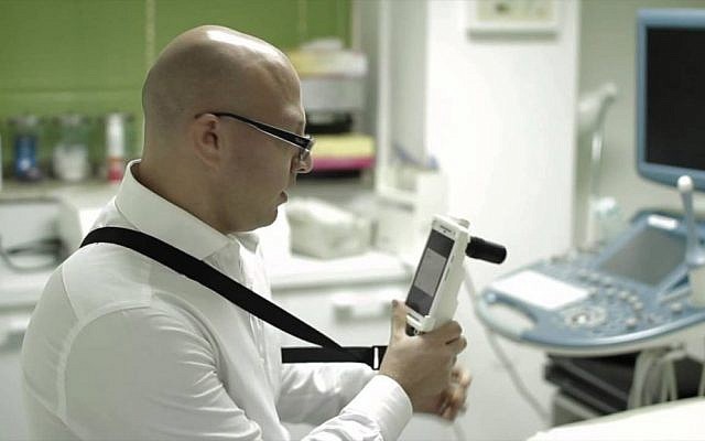 A doctor uses a  MobileODT colposcope (Photo credit: Courtesy)