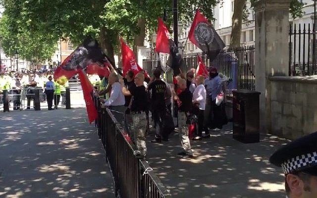 Illustrative image of two dozen neo-Nazis demonstrating in London on July 4, 2015 against the 'Jewification' of Golders Green in London. They were outnumbered by some 200 counter-demonstrators. (Screen capture/TheBlaze/YouTube. Used in accordance with clause 27a of the Copyright Law) Illustrative image of two dozen neo-Nazis demonstrating in London on July 4, 2015 against the 'Jewification' of Golders Green in London. They were outnumbered by some 200 counter-demonstrators. (Screen capture/TheBlaze/YouTube. Used in accordance with clause 27a of the Copyright Law)