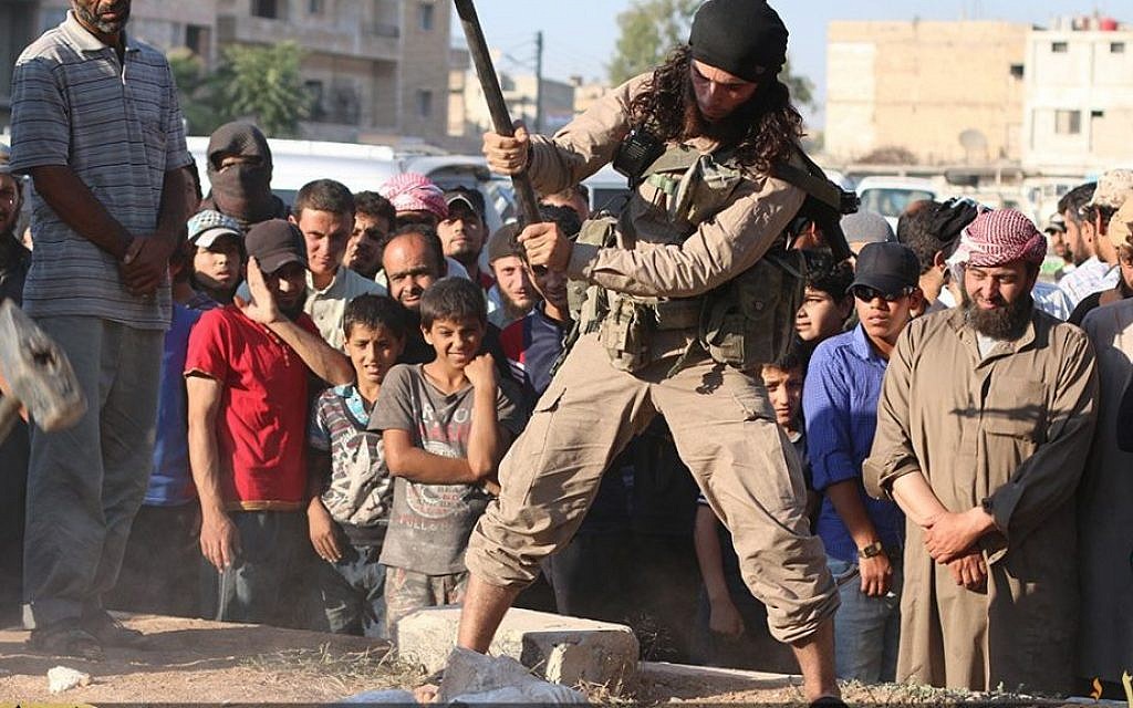 Illustrative: An Islamic State militant destroys ancient artifacts in the ancient Syrian city of Palmyra, Syria on July 2, 2015. (screen capture: Channel 4) Illustrative: An Islamic State militant destroys ancient artifacts in the ancient Syrian city of Palmyra, Syria on July 2, 2015. (screen capture: Channel 4)