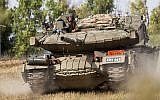 An Israeli Perah anti-missile launcher disguised as a Merkava tank rolls at an army deployment area near Israel's border with the Gaza Strip, on July 12, 2014. (AFP PHOTO / JACK GUEZ)