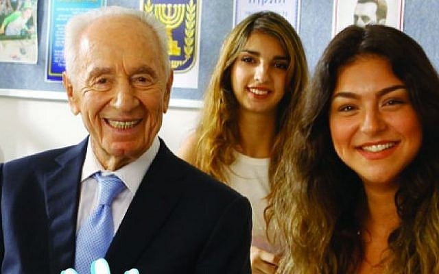 Former president Shimon Peres poses with two students on a recruitment poster for the Education Ministry's new 'Five Unit' math training program. (Education Ministry) Former president Shimon Peres poses with two students on a recruitment poster for the Education Ministry's new 'Five Unit' math training program. (Education Ministry)