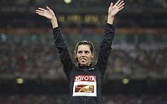 Israel's Hanna Knyazyeva-Minenko celebrates her silver medal on the podium during the victory ceremony for the women's triple jump athletics event at the 2015 IAAF World Championships at the 'Bird's Nest' national stadium in Beijing on August 24, 2015 (AFP PHOTO / GREG BAKER)