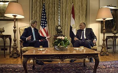 US Secretary of State John Kerry (L) and Egyptian Foreign Minister Sameh Shoukry (R) talk before a meeting at the Ministry of Foreign Affairs on August 2, 2015 in Cairo. (AFP Photo/Pool/Brendan Smialowski)