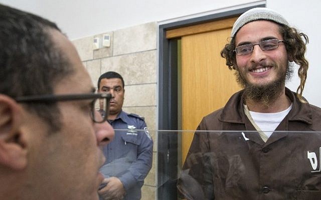 Meir Ettinger, the alleged head of a Jewish extremist group, at the Magistrate's Court in Nazareth Illit on August 4, 2015, a day after his arrest. (AFP/Jack Guez) Meir Ettinger, the alleged head of a Jewish extremist group, at the Magistrate's Court in Nazareth Illit on August 4, 2015, a day after his arrest. (AFP/Jack Guez)