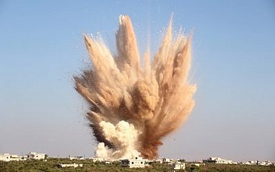 A picture taken on August 10, 2015, shows smoke billowing following a reported attack on a tunnel used by forces loyal to President Bashar al-Assad in the village of Foua, in the northwestern province of Idlib. (AFP PHOTO/OMAR HAJ KADOUR) A picture taken on August 10, 2015, shows smoke billowing following a reported attack on a tunnel used by forces loyal to President Bashar al-Assad in the village of Foua, in the northwestern province of Idlib. (AFP PHOTO/OMAR HAJ KADOUR)