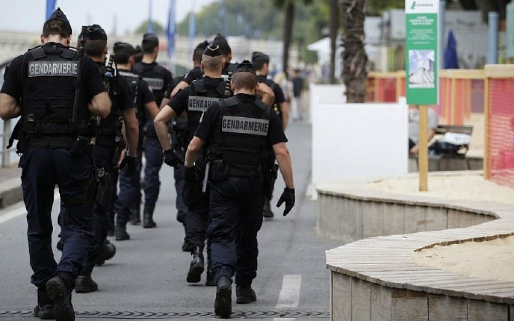 Gendarmes walk on  the quay of the river where is held "Gaza Plages" (Gaza Beach), near the "Tel-Aviv sur Seine" beach attraction during the 14th edition of Paris Plages (Paris Beaches) in central Paris, on August 13, 2015. The "Tel-Aviv sur Seine" attraction sparked uproar among some left-wing politicians and pro-Palestinian groups, and protesters have vowed to celebrate a "Gaza Beach" nearby.  (Kenzo Tribouillard/AFP)