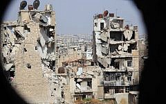 A general view taken from Aleppo's Syrian regime-controlled neighborhood of Karm al-Jabal shows heavily damaged buildings on July 30, 2015. (AFP/George Ourfalian)