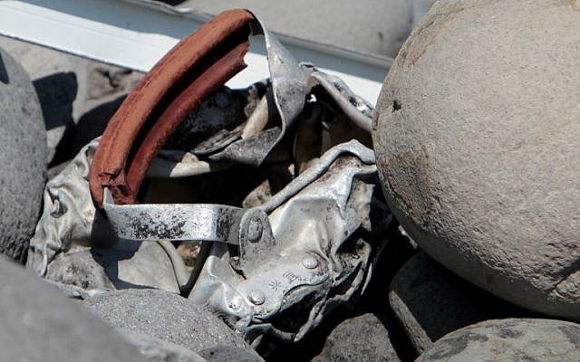 Metallic debris found on a beach on the French Reunion Island in the Indian Ocean, close to where where a wing part believed to belong to missing flight MH370 washed up last week. (Richard Bouhet/ AFP) Metallic debris found on a beach on the French Reunion Island in the Indian Ocean, close to where where a wing part believed to belong to missing flight MH370 washed up last week. (Richard Bouhet/ AFP)