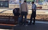Police detaining a suspect on the platform at the main train station in Arras, northern France, on August 21, 2015, after an armed gunman on the train was overpowered by passengers. (AFP Photo/Courtesy of Christina Catherine Coons)