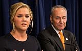 Comedian Amy Schumer (L) and US Senator Chuck Schumer (D-NY) speak at a press conference calling for tighter gun laws in an effort to stop mass shootings and gun violence on August 3, 2015 in New York City. (Andrew Burton/Getty Images/AFP)