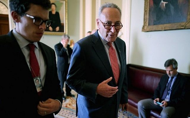 Sen. Charles (Chuck) Schumer (right) talks with a staff member after the weekly Democratic policy luncheon at the US Capitol in Washington, DC, August 4, 2015. (Chip Somodevilla/Getty Images/AFP) Sen. Charles (Chuck) Schumer (right) talks with a staff member after the weekly Democratic policy luncheon at the US Capitol in Washington, DC, August 4, 2015. (Chip Somodevilla/Getty Images/AFP)