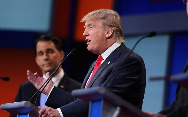 Republican presidential candidates Wisconsin Gov. Scott Walker (left) and Donald Trump participate in the first prime-time presidential debate in Cleveland, Ohio, August 6, 2015. (Scott Olson/Getty Images/AFP)