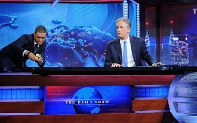 Trevor Noah and host Jon Stewart appear on "The Daily Show with Jon Stewart" on August 6, 2015 in New York City.  (Brad Barket/Getty Images for Comedy Central/AFP)