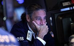 A trader works on the floor of the New York Stock Exchange (NYSE) on August 24, 2015 in New York City (Spencer Platt/Getty Images/AFP)