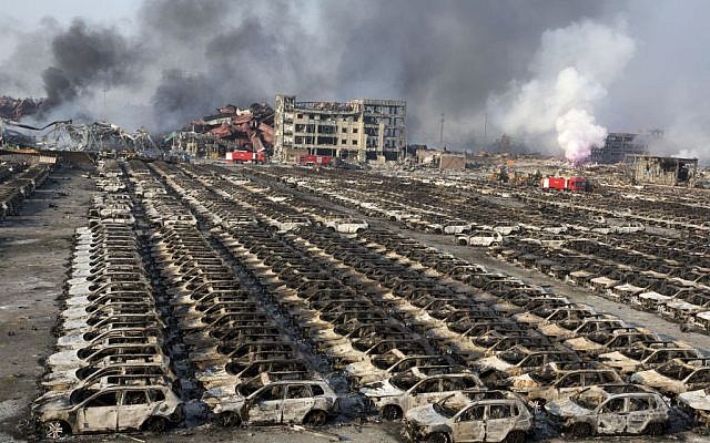 Smoke billows from the site of an explosion that reduced a parking lot filled with new cars to charred remains at a warehouse in northeastern China's Tianjin municipality, Thursday, Aug. 13, 2015. (AP Photo/Ng Han Guan) Smoke billows from the site of an explosion that reduced a parking lot filled with new cars to charred remains at a warehouse in northeastern China's Tianjin municipality, Thursday, Aug. 13, 2015. (AP Photo/Ng Han Guan)